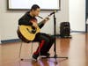 Singing and Guitar playing by Jake He, SEEDS member
