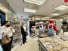 Passing by the kitchen, the visitors are impressed with the kitchen staff busy preparing delicious steamed stuffed buns.