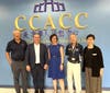 A joyful group photo taken in the lobby of the first floor at CCACC.