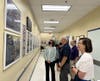 Delegate Julie Palakovich Carr visited the photo memorial wall in the first-floor hallway.