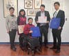 Ms. Lewi (front row) presented the 2025 CCACC calendars and insulated shopping bags to Mr. Sean Liu (Second from the right in the back row) and Mr. Matthew Hsu (Right in the back row).