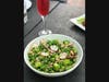 Seasonal asparagus salad paired with a Bleu French 75 cocktail