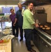 Members of the Men’s Group of the United Methodist Church get ready for the Palm Sunday Breakfast