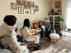 A resident (1st from right) at the Londonderry Towers Apartments in Gaithersburg allows the canvassers to enter her apartment to discuss how to improve the community.
