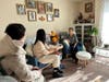 A resident (1st from right) at the Londonderry Towers Apartments in Gaithersburg allows the canvassers to enter her apartment to discuss how to improve the community.