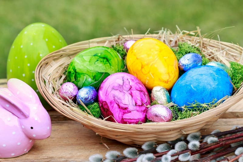 Traditional Easter basket with colorful eggs.
