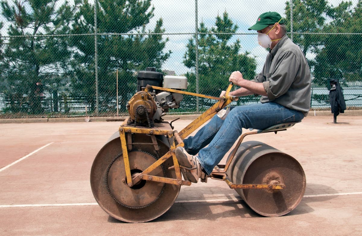 Mark McIntyre working on the courts.
