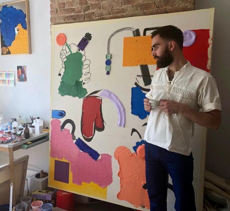 Jean Francois stands in front of a new piece