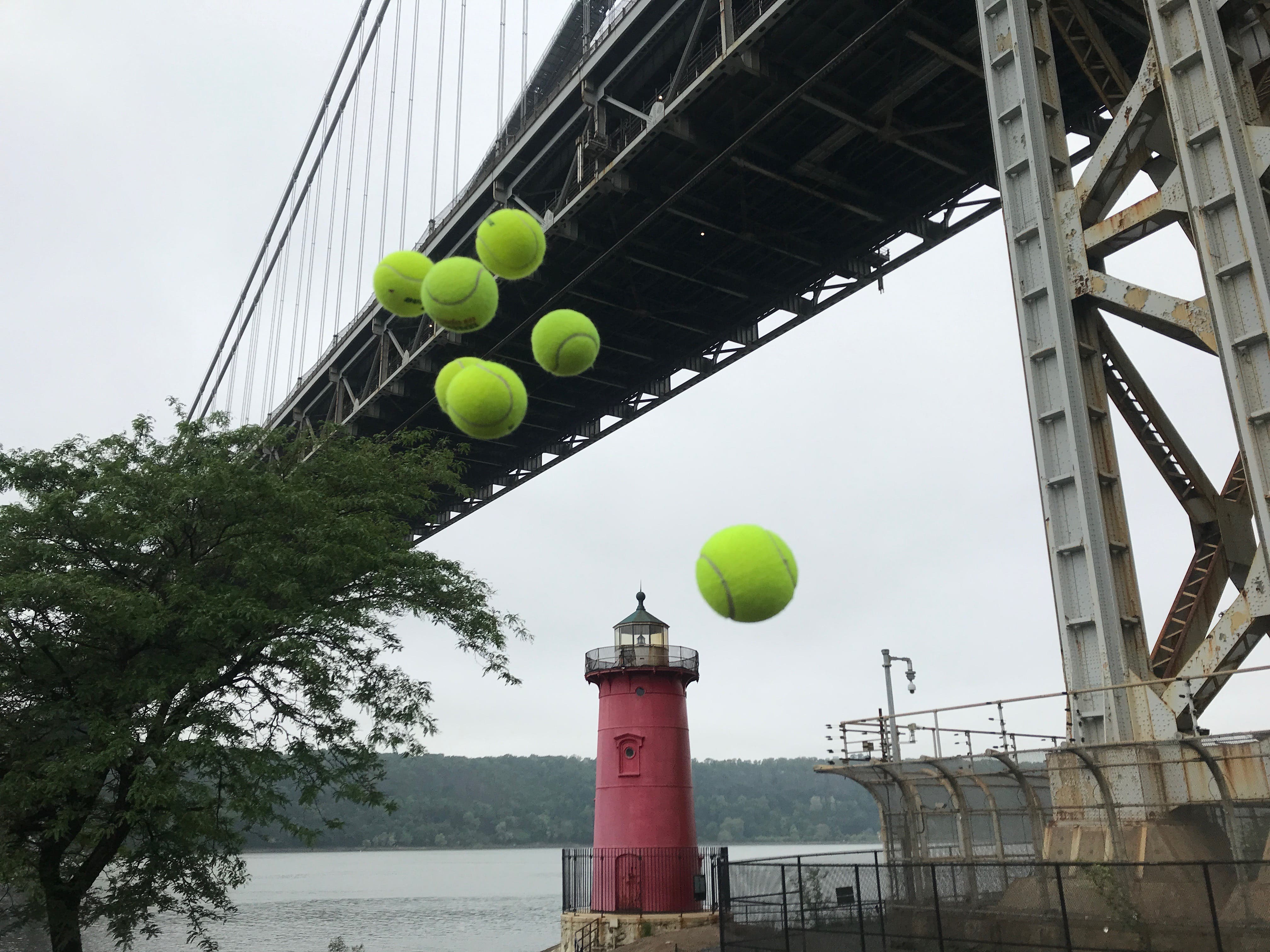 Tennis balls thrown in front of Red Light House