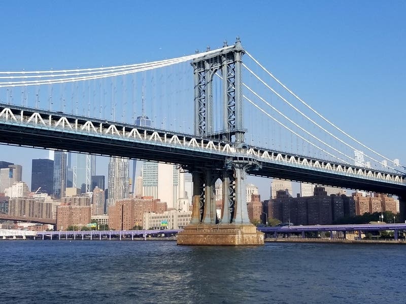 Views of the Manhattan Bridge with downtown Manhattan in the background.
