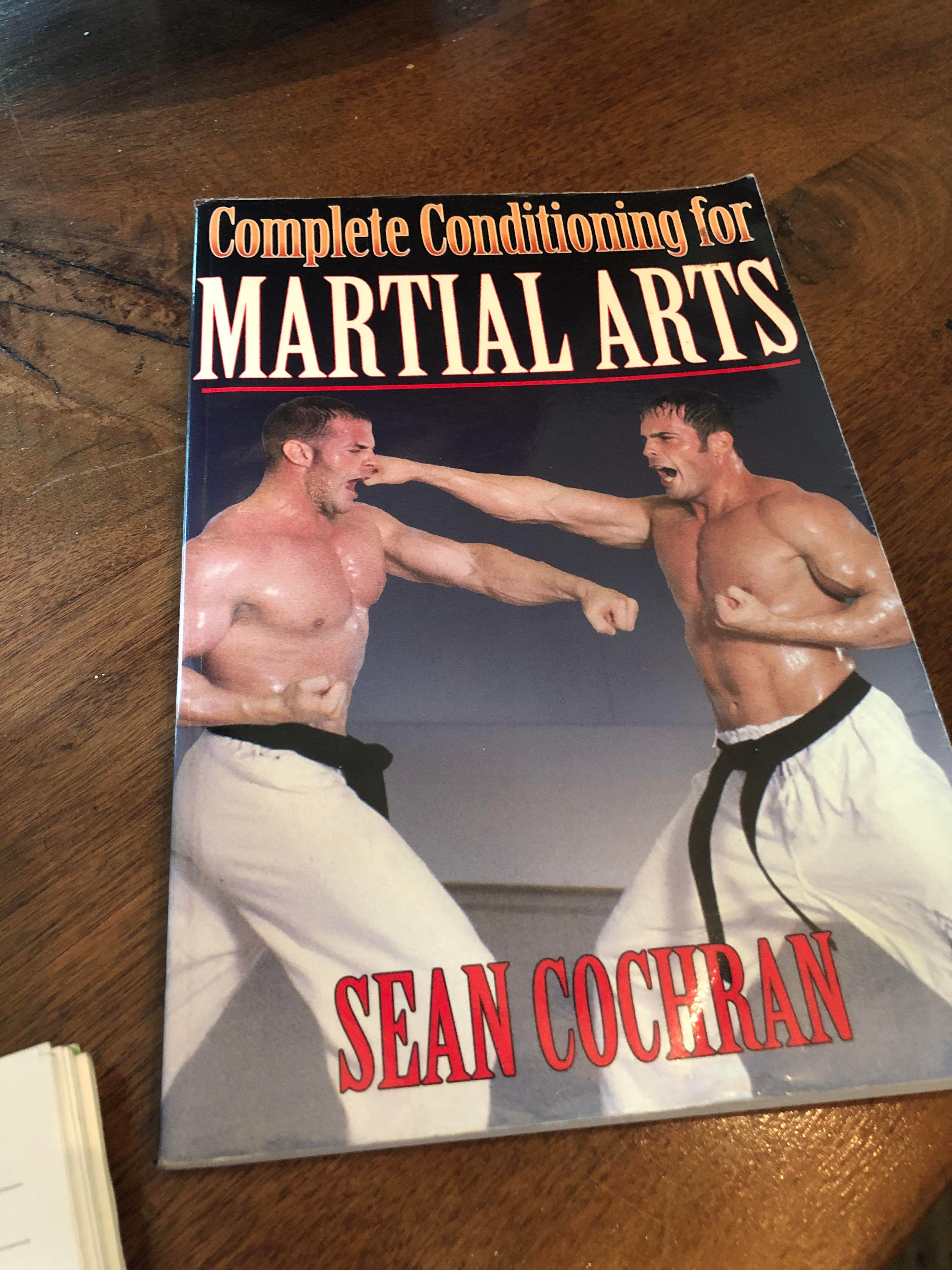 Todd Arnett, on the right, practicing martial arts with his brother.