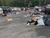 The parking lot of the Long Island Community Amphitheater was left littered with trash after a night of live music.