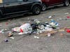 The parking lot of the Long Island Community Amphitheater was left littered with trash after a night of live music.