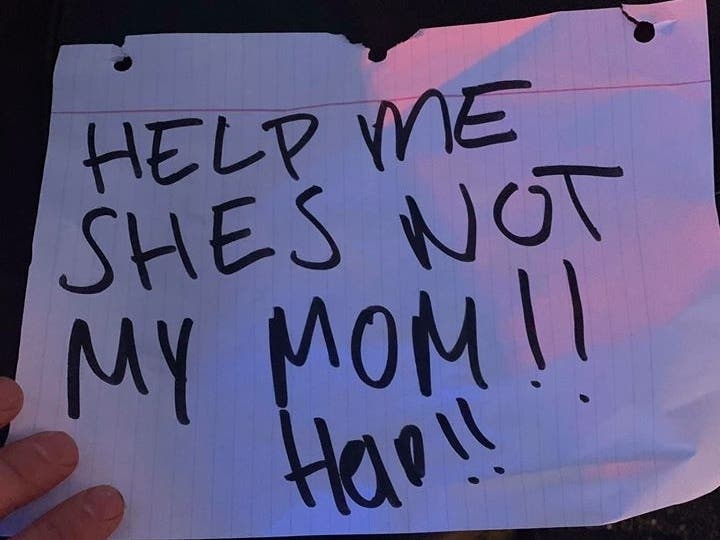 Officers responded after receiving a call that a girl was holding a "Help me" sign in the backseat of a vehicle traveling down State Route 99.