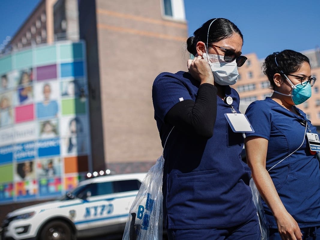 Nurses leave Elmhurst Hospital Center where COVID-19 testing continues in New York.