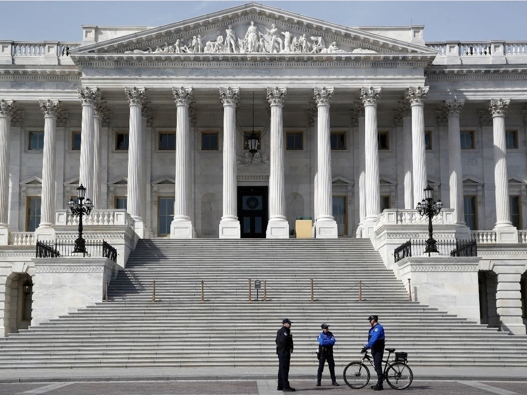 Police officers stand outside the U.S. Senate steps on Capitol Hill in Washington, D.C. 