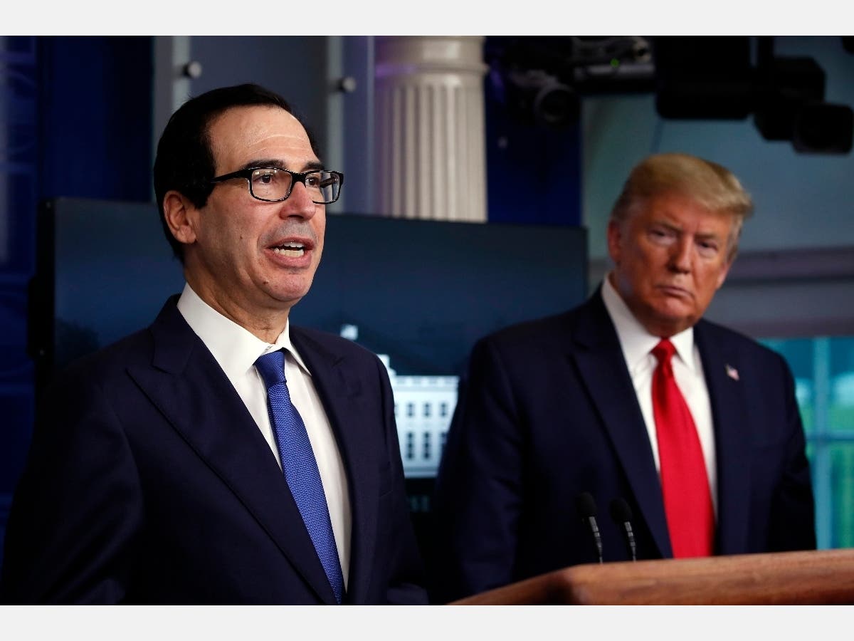 President Donald Trump listens as Treasury Secretary Steven Mnuchin speaks about the coronavirus in the James Brady Press Briefing Room at the White House.