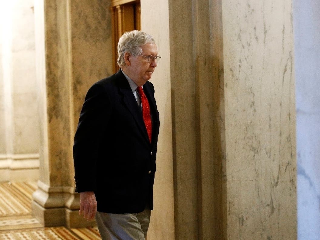 Senate Majority Leader Mitch McConnell of Ky., walks to his office on Capitol Hill in Washington.