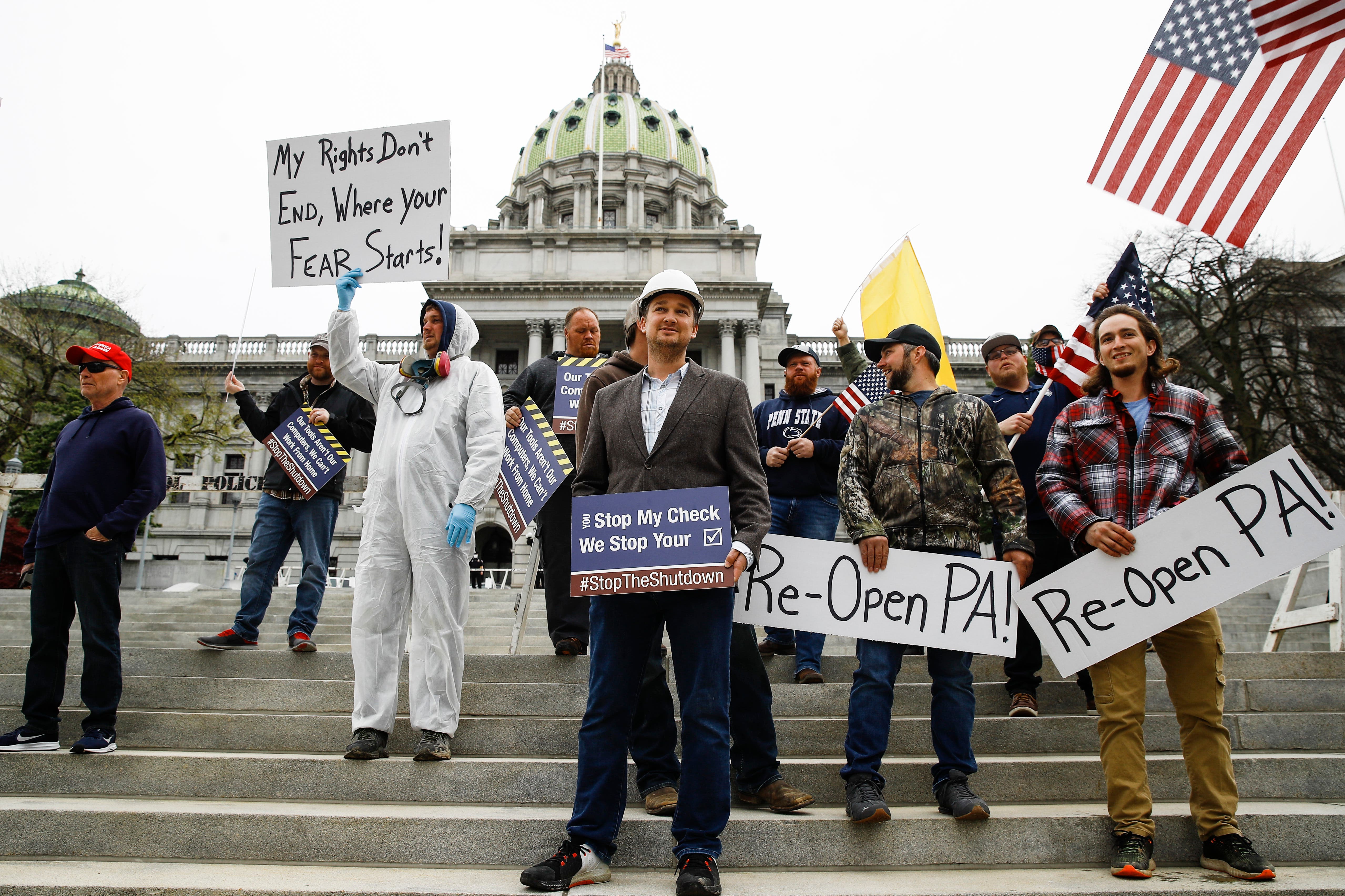Protesters demonstrate at the state Capitol in Harrisburg, Pennsylvania, demanding that Gov. Tom Wolf reopen Pennsylvania's economy.