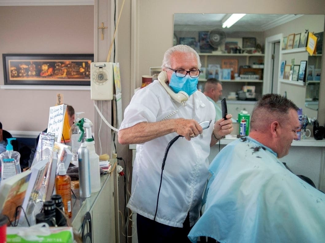 A Michigan barber reopened his doors Monday in defiance of Gov. Gretchen Whitmer's executive order mandating salons, barbershops and other businesses to stay closed.