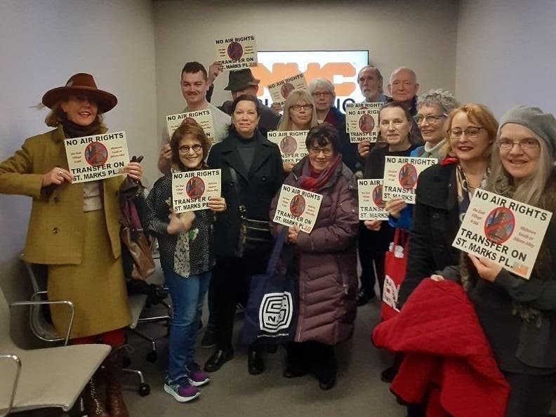 An image of a group from the Greenwich Village Society For Historic Preservation protesting the air-rights transfer for 3 St. Mark's Place.