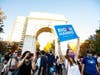 People celebrate the outcome of the 2020 general election near the arch in Washington Square Park.