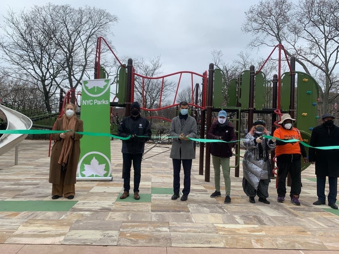 An image of the ribbon cutting ceremony at Adventure Playground in Highbridge Park.