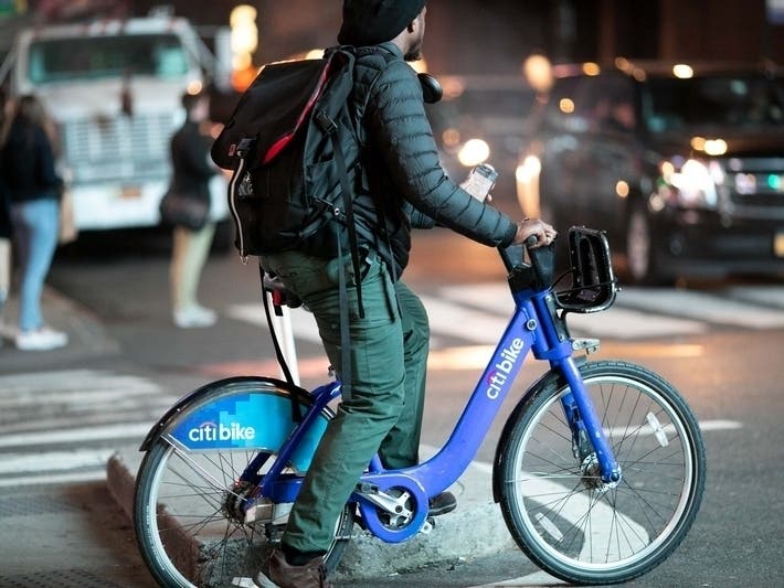 An image of a man riding a Citi Bike in New York City.