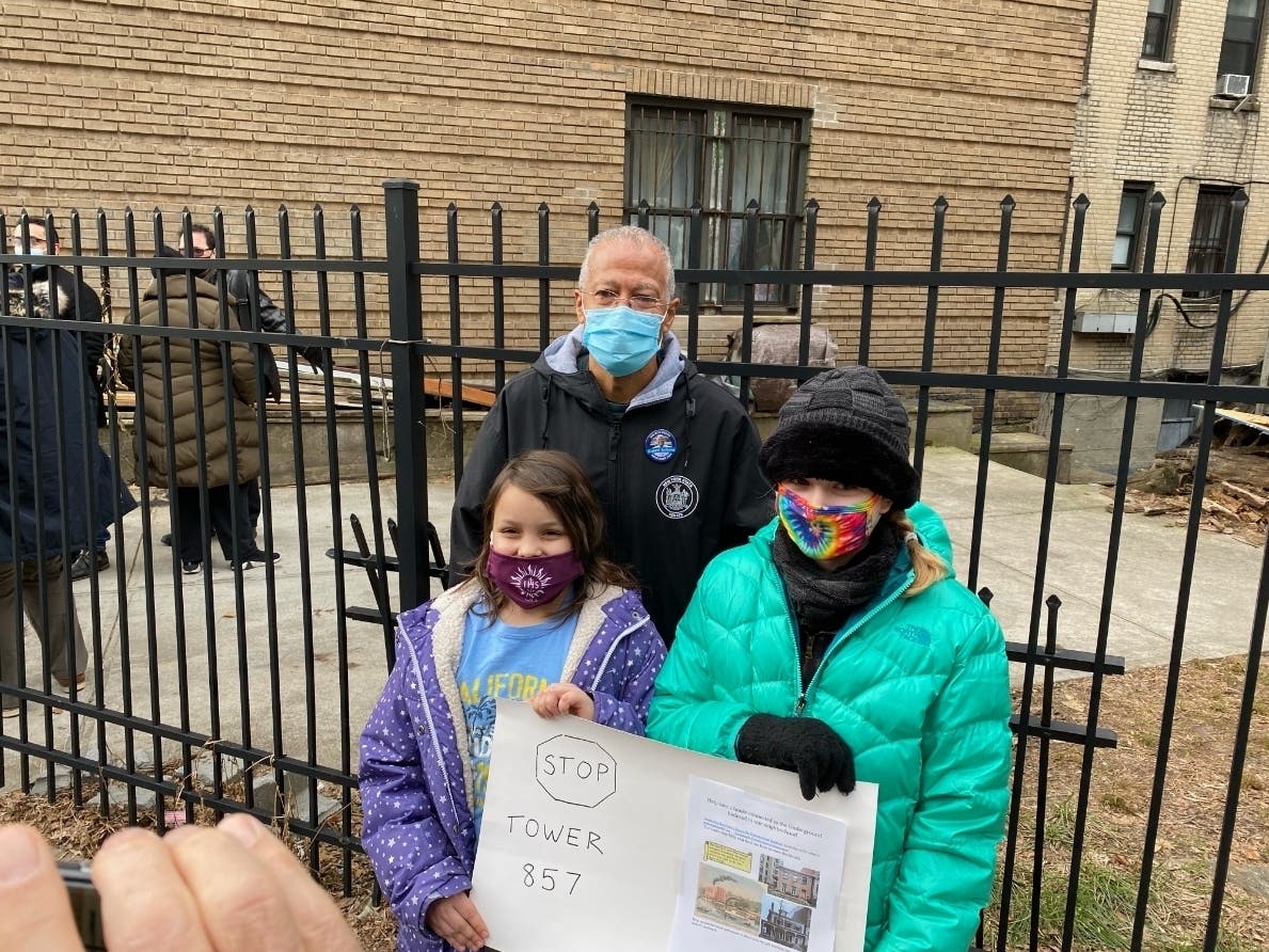 State Senator Robert Jackson with community members at the news conference calling for landmark status of 858 Riverside Drive.