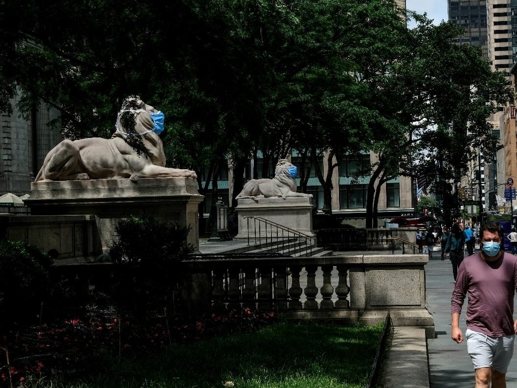 Patience and Fortitude, the marble lion statues at the entrance to the New York Public Library, are adorned with face masks.
