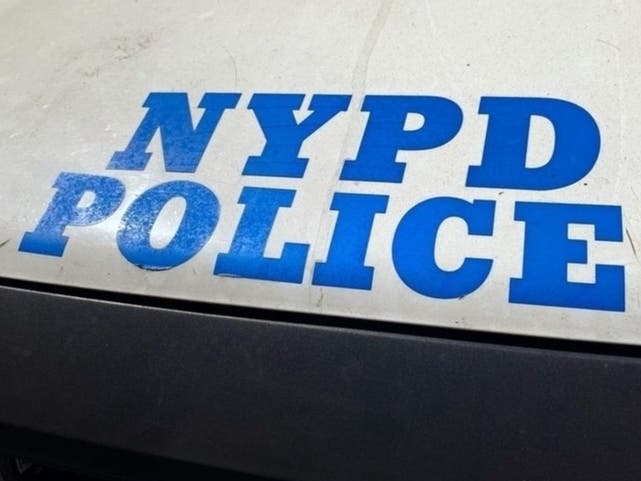 An image of NYPD Police written out on the side of a cop car.