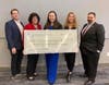 Jeremy Faberlle, MRCC Executive Director Terese Rölke, Kathrine Dwyer, Tricia McLaughlin of CASA, and MRCC President Tamer Gouda with the $6,500 donation check for CASA of Monmouth County