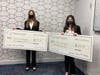 MRCC Team Challenge Essay Contest winners Katrine Birkeland from Manalapan High School and Jonna Crocker from Howell Township High School hold their award checks.