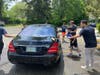 Members of the community coming together to wash cars