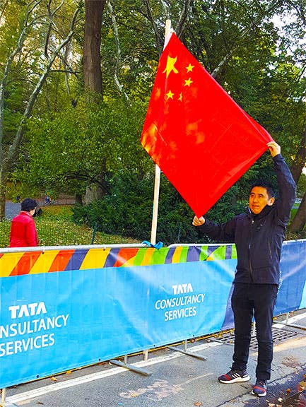 Holding up a flag for that memorable picture Holding up a flag for that memorable picture