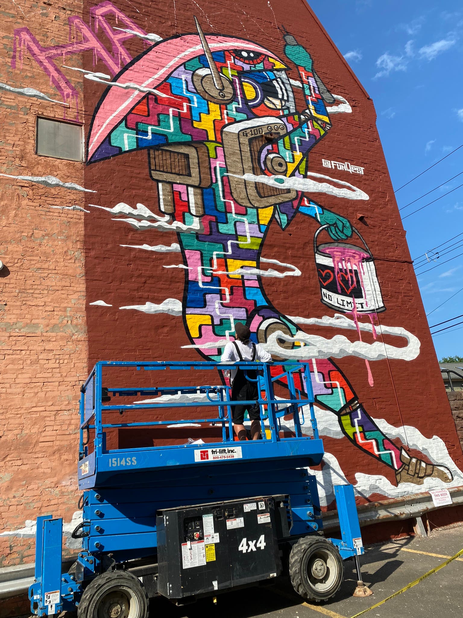 FunQest Street Artist Hard At Work on a Hot Day 
