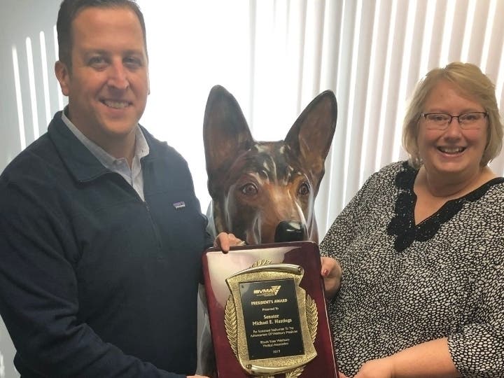 Sen. Hastings is presented the President's Award by Debbie Lakamp of ISVMA