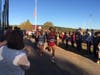 Stratford's Amos Colocho and New Milford's Caleb Cerra enter the one mile mark in a heavily crowded asphalt pathway during the 2021 SWC XC Championships.