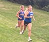 Bunnell's Peyton Biggs with a slight lead over a Brookfield runner at the one mile marker in week two of SWC cross country action at Joel Barlow High School. Biggs is a Sophomore and is on the rise for the Bulldogs. 