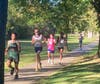 Bunnell's Blake Staffey, in the BHS pink Cancer Awareness jersey is sandwiched between a pair of Immaculate runners nearing the two mile mark.   Staffey went to record his best place finish and time finish.  He's enjoying quite a rookie season.