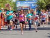Children dash down Broad Street in the children’s run at the Red Bank Classic. 