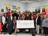 Mayor Pasquale Menna (front row, third from left) & Red Bank Schools Superintendent Jared Rumage (back row, second from left), Red Bank Primary School students, administrators and YMCA representatives celebrate a $10,000 donation for swim lessons.