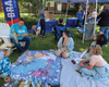 Keene Elementary School staff read to community members at Newark Community Day. 