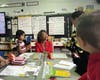U.S. Representative Lisa Blunt Rochester talks with students from Thurgood Marshall Elementary School.