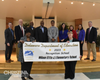Administrators and staff from Wilson Elementary School stand with the Delaware Department of Education Board Members during the State Board of Education Meeting. 