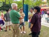 Broadview resident David Kellogg speaking with Purchase Students at block party