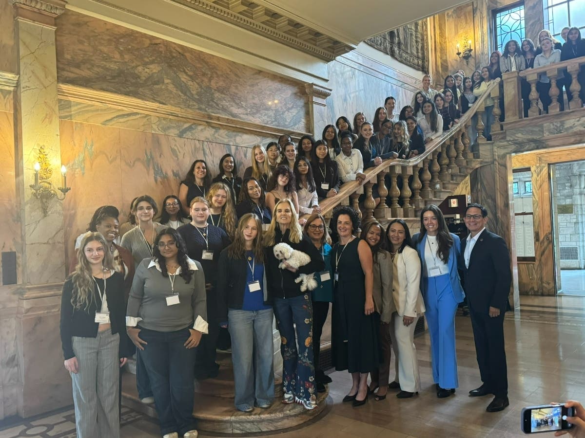 Kerry Kennedy (center) with students, doctoral program members and President Frank D. Sanchez (far right)