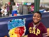 Lace student beaming with pride on exhibit day