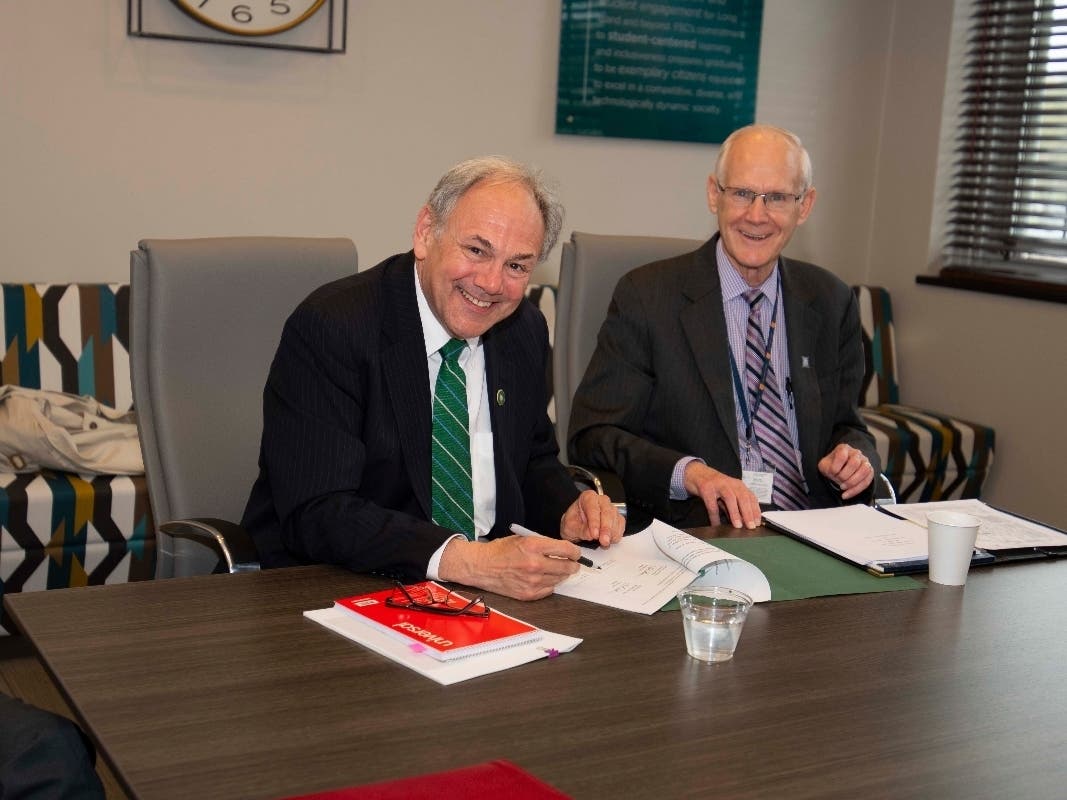 Farmingdale President John Nader (left) came to an agreement with Nassau President Hubert Keen.