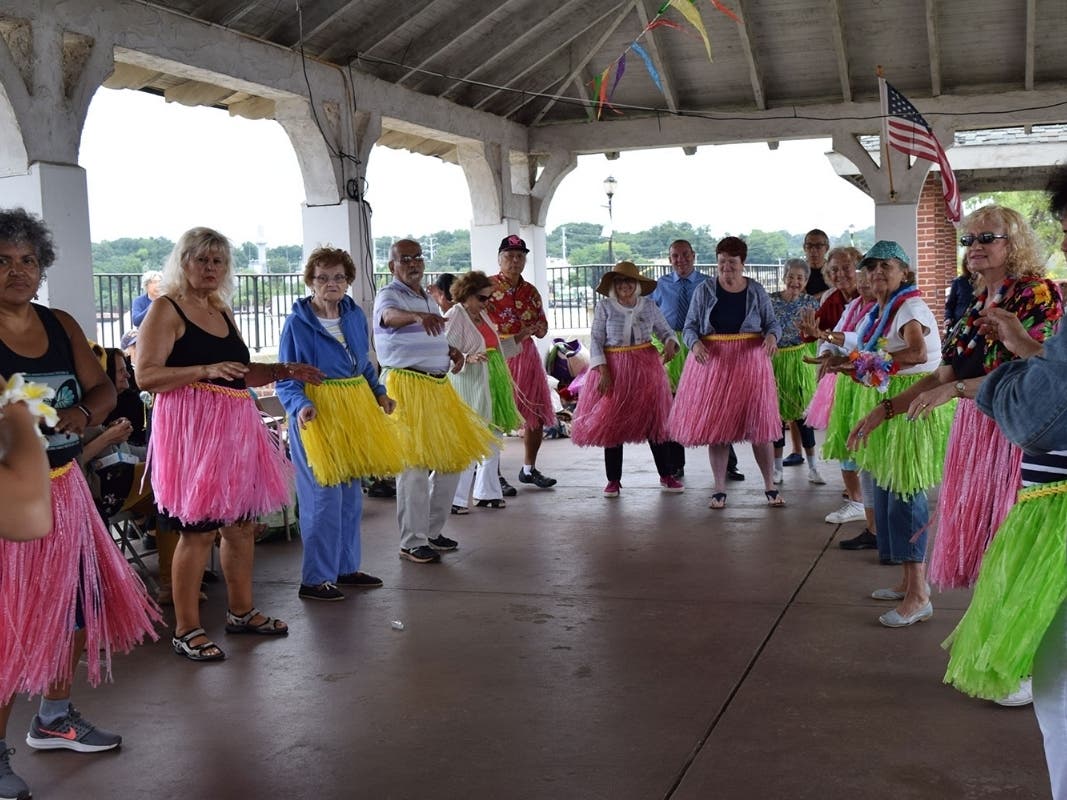 Residents dance the hula at FunDay Monday.
